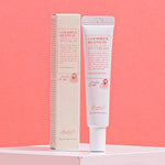 Benton Goodbye Redness Centella Spot Cream tube with packaging on a pastel pink background, emphasizing soothing skincare for sensitive, stressed skin.
