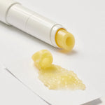 Beplain Chamomile Intense Moisturizing Lip Balm with a glossy yellow swatch spread beside the tube on a white surface.