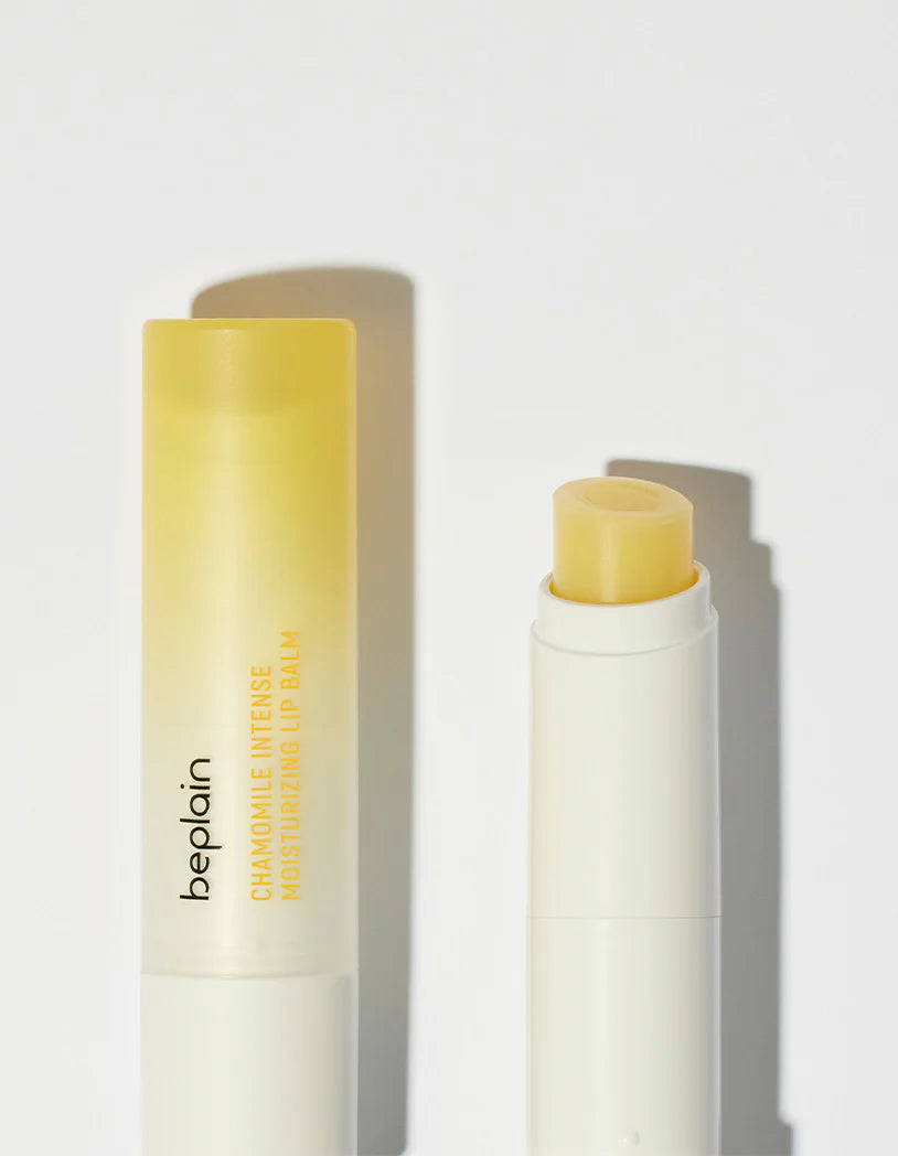 Beplain Chamomile Intense Moisturizing Lip Balm with its yellow balm visible inside the tube, placed on a clean white background.