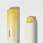 Beplain Chamomile Intense Moisturizing Lip Balm with its yellow balm visible inside the tube, placed on a clean white background.