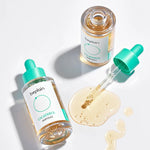 Two Beplain Cicaterol Ampoule bottles, with one dropper releasing amber serum surrounded by serum drops on a white surface.