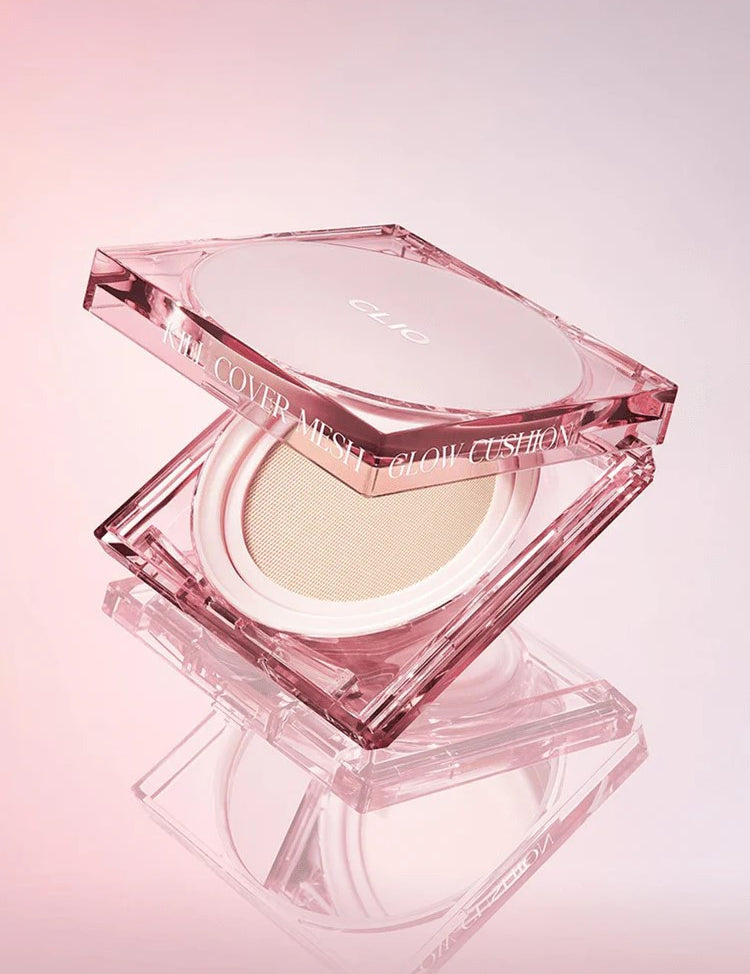 Pink hexagonal compact of CLIO Kill Cover Mesh Glow Cushion, partially open to reveal the cushion inside, on a soft gradient background.