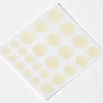 Cosrx Acne Pimple Master Patches in various sizes, arranged on a transparent backing, set against a white background.
