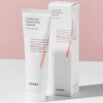 A tube and box of Cosrx Comfort Ceramide Cream against a soft pink background, highlighting minimalist packaging and ingredients list.