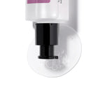 Cosrx Galactomyces 95 Tone Balancing Essence dispensing its gel-like texture with bubbles onto a smooth surface.