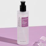 Cosrx Galactomyces 95 Tone Balancing Essence on a purple surface, highlighting its sleek and minimalist design.