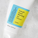 A tube of Cosrx Low pH Good Morning Gel Cleanser partially submerged in bubbles, highlighting its soothing formula and low pH.