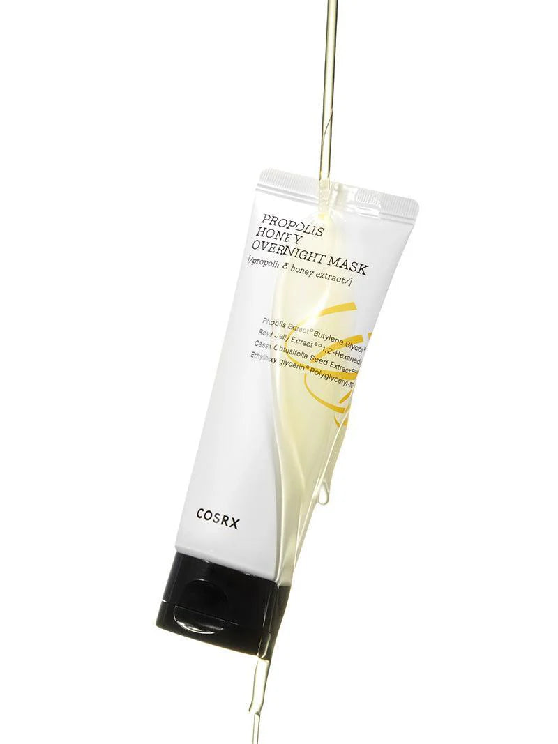 A tube of Cosrx Propolis Honey Overnight Mask, dripping with golden honey, highlighting its nourishing ingredients for skin care.