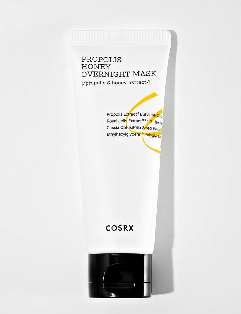 A white tube of Cosrx Propolis Honey Overnight Mask with a black cap, designed for hydration, nourishment, and glowing skin, featuring a sleek design and ingredient details.