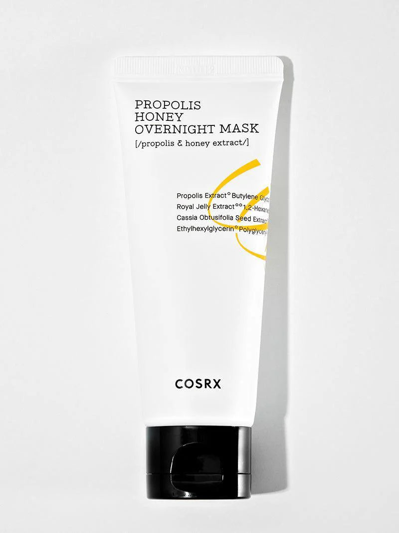 A white tube of Cosrx Propolis Honey Overnight Mask with a black cap, designed for hydration, nourishment, and glowing skin, featuring a sleek design and ingredient details.