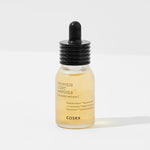 Cosrx Propolis Light Ampoule in a clear glass dropper bottle with a black lid, featuring light amber liquid and minimalistic label design.