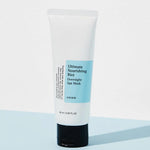 Cosrx Ultimate Nourishing Rice Overnight Spa Mask in a white tube with blue label, resting on a light blue background.