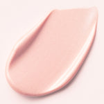A smooth, glowing pink cream of d'Alba Waterfull Tone-Up Sunscreen swirled on a light background, highlighting its texture that corrects redness, delivers a tone-up effect, and doubles as a primer.