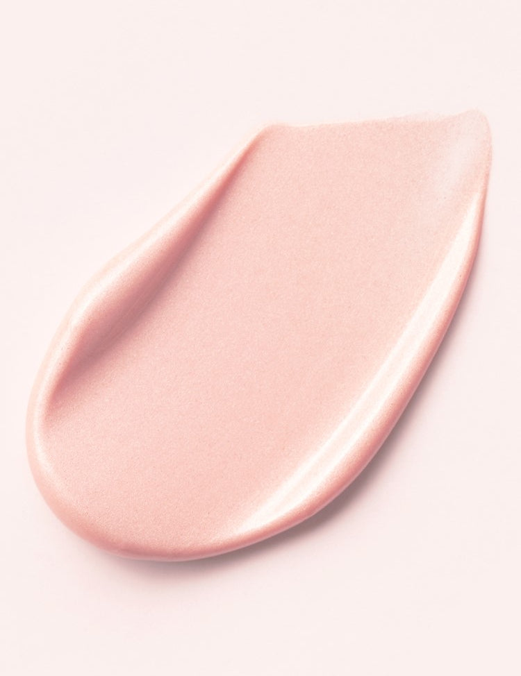 A smooth, glowing pink cream of d'Alba Waterfull Tone-Up Sunscreen swirled on a light background, highlighting its texture that corrects redness, delivers a tone-up effect, and doubles as a primer.