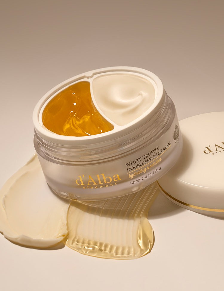A jar of d'Alba White Truffle Double Serum & Cream, showcasing its gold jelly and white cream formula designed to hydrate and nourish the skin.