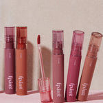 A collection of six Etude House Fixing Tints in shades of pink and nude, displayed against a soft pink backdrop.