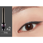 Close-up of an eye wearing sharp gray eyeliner from the Etude House Oh My Line Collection, featuring a smooth winged tip, with the eyeliner product labeled 'Gray #2' displayed nearby.