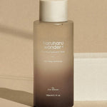 A sleek bottle of Haruharu Wonder Black Rice Hyaluronic Toner on a neutral background, showcasing its minimalist design and branding.