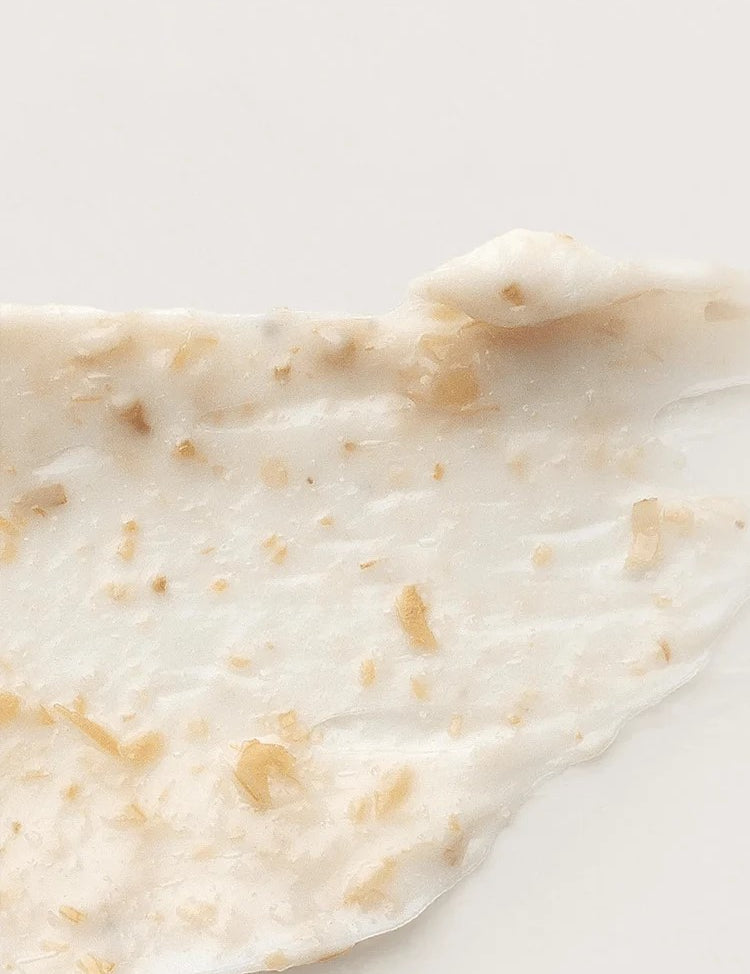 Close-up of the creamy white texture of the 'I'm From' Rice Mask, flecked with small rice hull particles for gentle exfoliation.