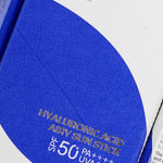 Close-up of the Isntree Hyaluronic Acid Airy Sun Stick packaging with SPF 50+, featuring blue design elements and key benefits listed.