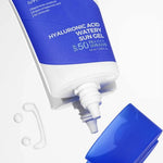 Tube of Isntree Hyaluronic Acid Watery Sun Gel SPF 50 placed next to a small drop of the gel, highlighting its lightweight texture.