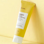 A yellow tube of iUNIK Propolis Vitamin Sleeping Mask against a soft yellow background, promoting hydration and nourishment for all skin types.