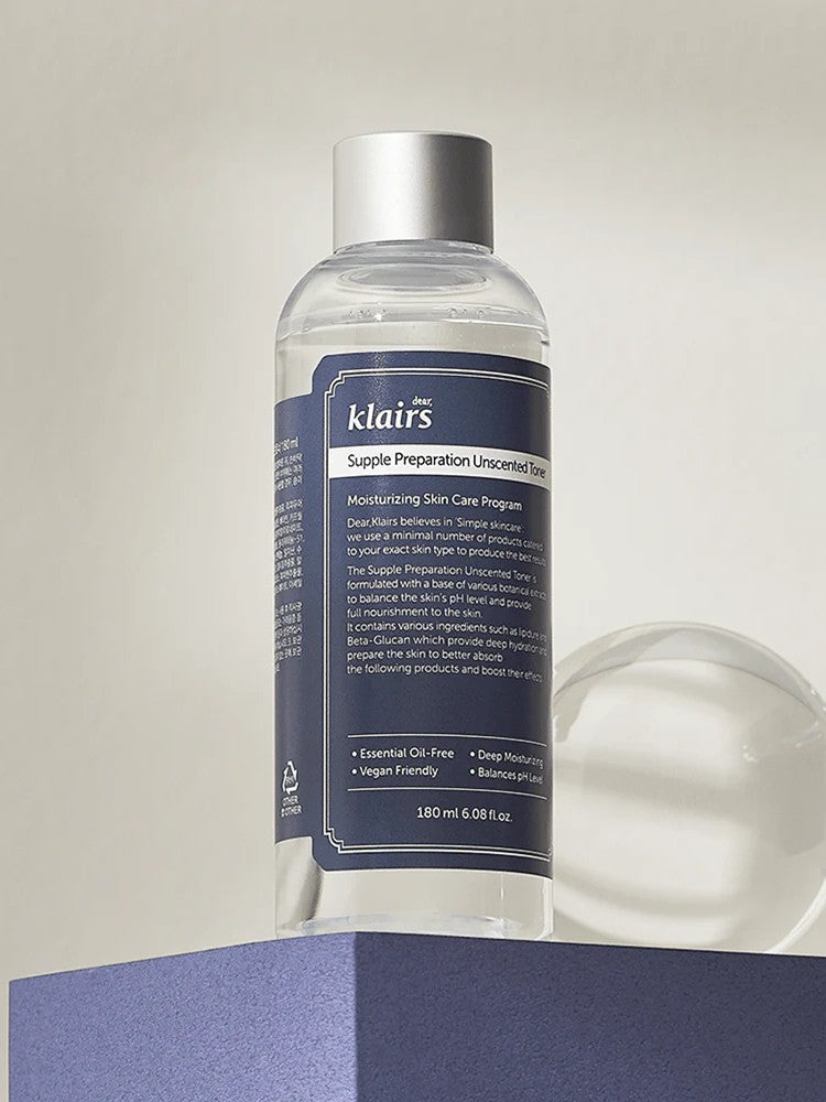 Klairs Supple Preparation Unscented Toner bottle with a sleek design and detailed label, elegantly displayed on a purple pedestal, emphasizing its hydrating and soothing properties.
