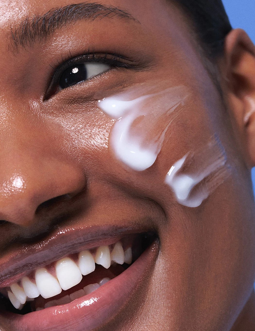 Close-up of a model’s cheek showcasing the lightweight gel texture of the Laneige Water Sleeping Mask, highlighting its smooth application and hydrating benefits.