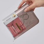 A hand holds the Mediheal Collagen Nude Gel Mask, with essence spilling out, emphasizing its hydrating and nourishing properties.