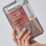 A hand holding a Mediheal Collagen Nude Gel Mask, showcasing sleek silver packaging with pink and bubble accents.