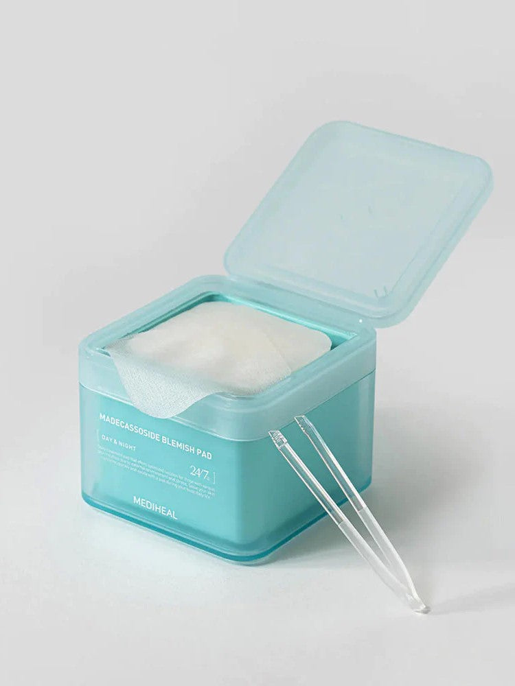 Open turquoise box of Mediheal Madecassoside Blemish Pad, revealing a white cotton pad and tweezers for easy application.