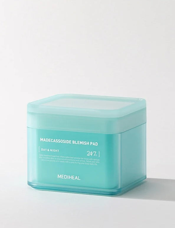 Teal container of Mediheal Madecassoside Blemish Pad, labeled for day and night use, specially formulated for blemish treatment.