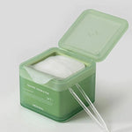 Open green box of Mediheal Teatree Trouble Pad, revealing a white cotton pad with tweezers for easy application.