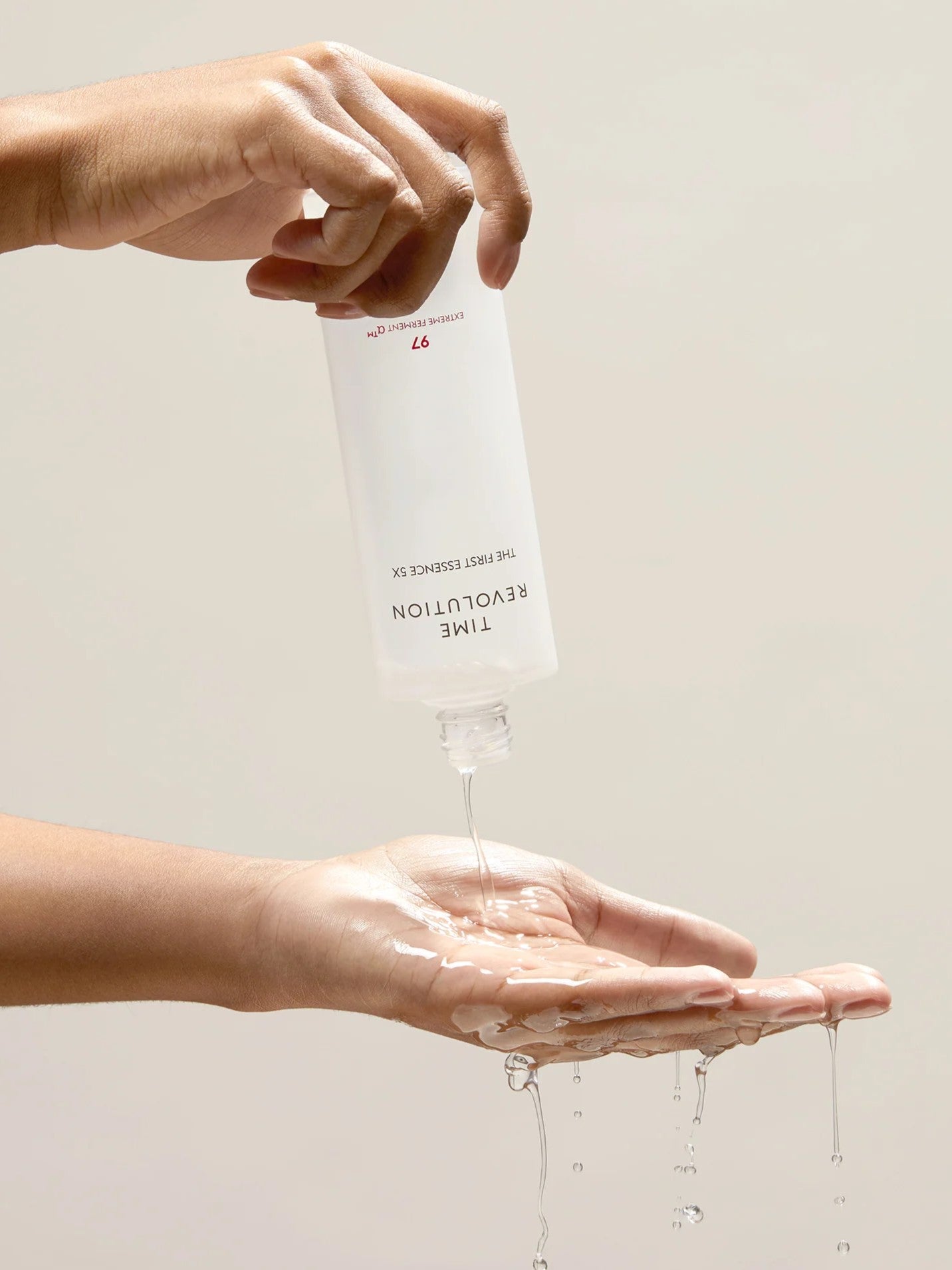 missha time revolution the first essence texture with hands