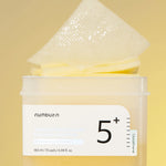 The texture of Numbuzin No.5 Vitamin-Niacinamide Concentrated Pad, highlighting its pure cotton gauze material.