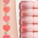 Swatches of peachy lip colors from Peripera INK Airy Velvet lip tint Peaches Collection on an arm, with matching tubes showing texture.