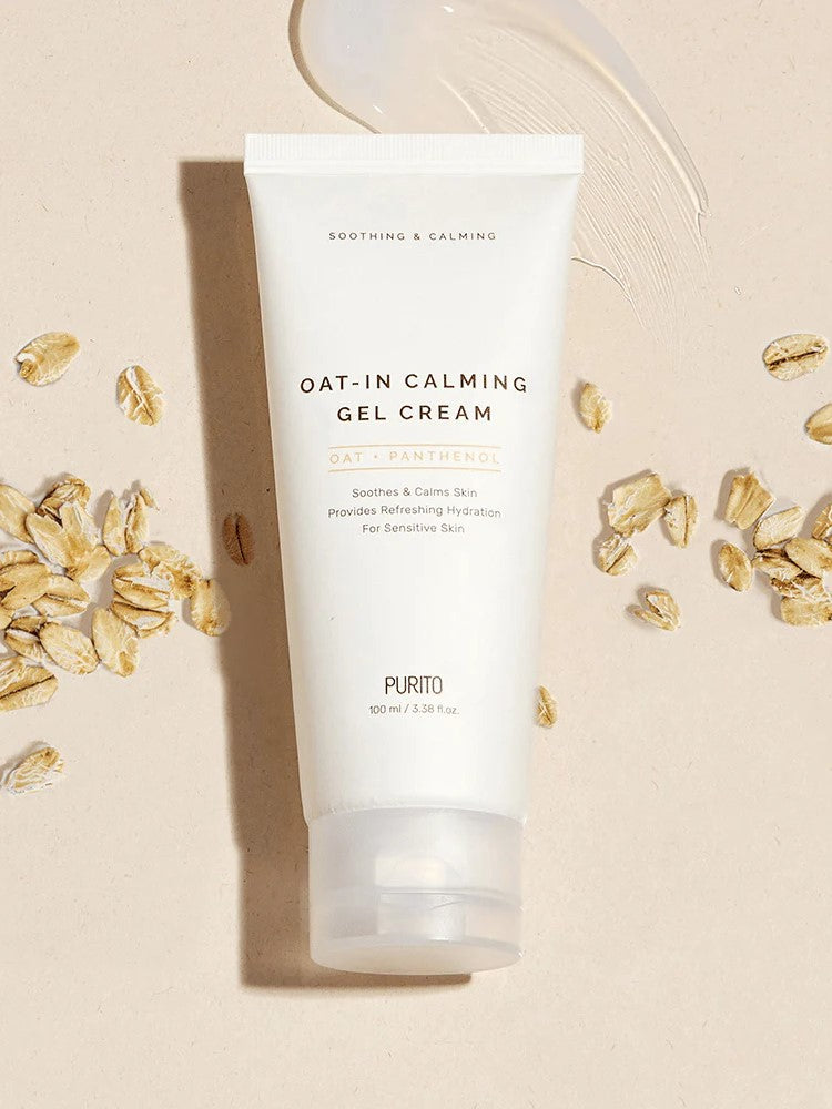 Tube of Purito Oat-in Calming Gel Cream featuring oats and Panthenol, surrounded by oat flakes on a textured background.
