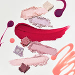 Artistic arrangement of pink, red, and purple makeup pigments from the Romand Better Than Palette Energetic Series in 'Berry Fuchsia Garden,' set against a clean white background.