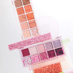 Two Romand Better Than Palette Energetic Series eyeshadow palettes stacked on vibrant sponges, showcasing shades from warm neutrals to rich purples.