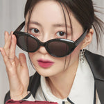 A model wearing Romand Blur Fudge Tint in the shade Cool Rose Up, showcasing the soft matte texture on her lips.