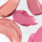 Smooth swatches of pink and nude shades from Romand Glasting Color Tint, displayed on a white background to show glossy textures and finishes.