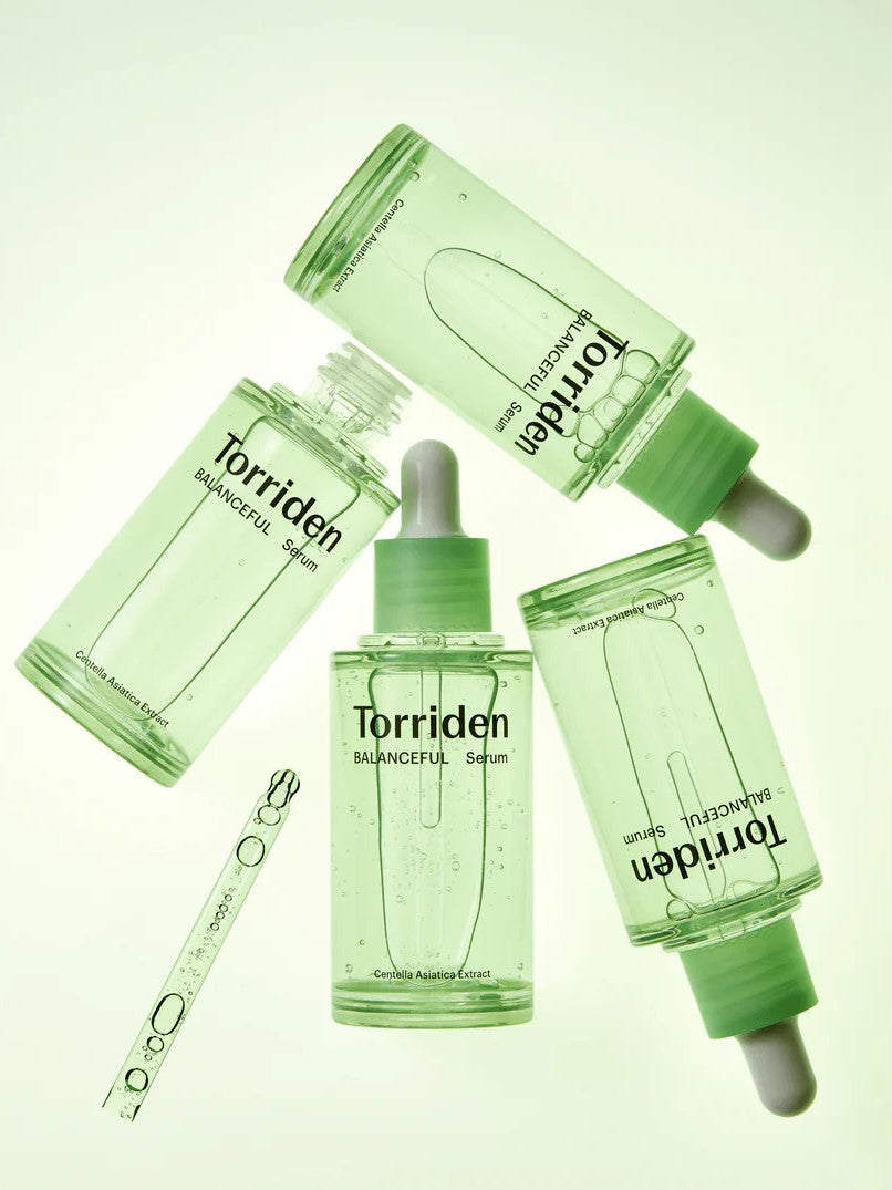 Four bottles of Torriden Balanceful Cica Serum in a refreshing green hue, with droppers and product details prominently displayed.