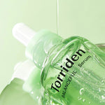 "Torriden Balanceful Serum with lightweight formula dripping from the dropper.