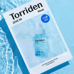 Torriden Dive In Mask package resting on water, featuring a serum bottle graphic and text highlighting low molecular Hyaluronic Acid.