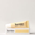 A tube of Torriden Solid In Lip Essence is placed atop its white box, showcasing minimalistic design with a yellow color scheme.